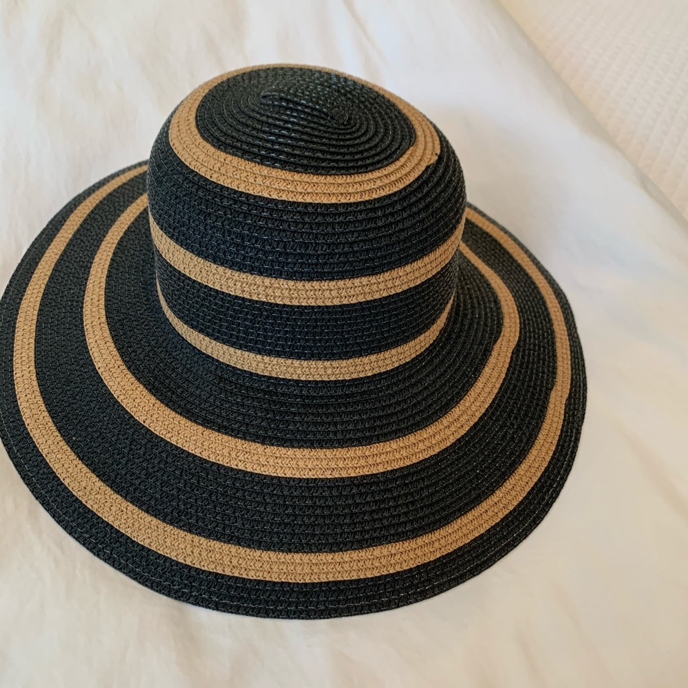Black and Tan round hat with adjustable fit